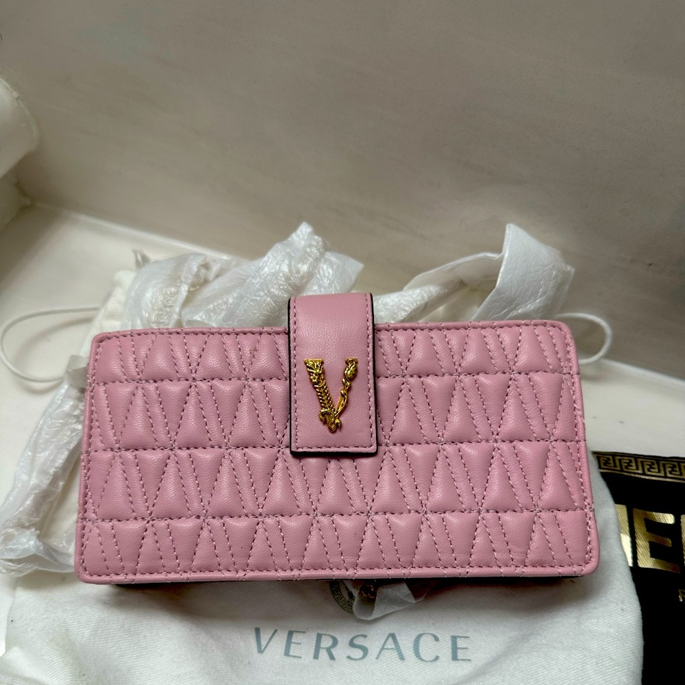 A pink purse by for Versace Versace
